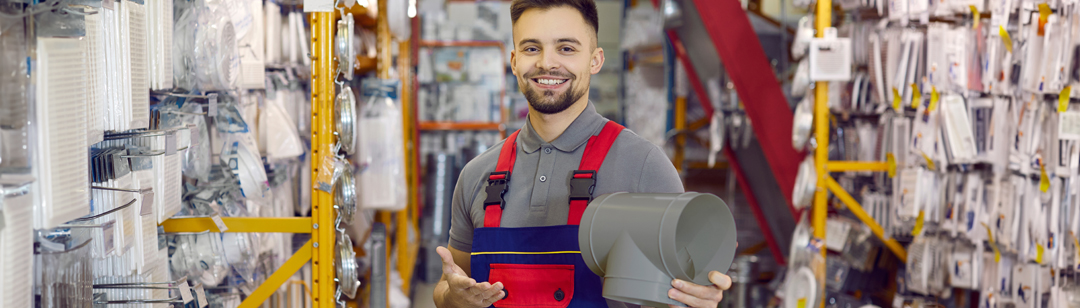 happy-shop-assistant-who-works-at-diy-retail-store-cheerful-handsome-man-in-uniform-banner