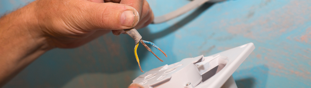 man-is-installing-the-wall-bathroom-fan-vent-restoration-process-wires-in-hands-maintenance-banner